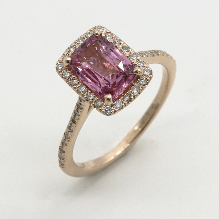 A large oval moissanite set in a sleek platinum statement mounting